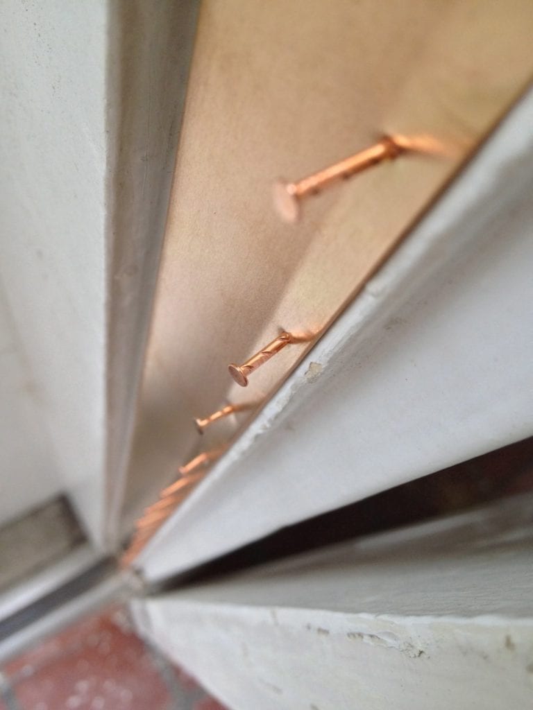 How To: Install Spring Bronze Weatherstripping | The Craftsman Blog