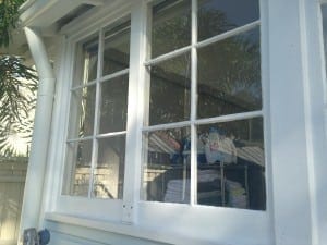 The larger mullion separates these two 6-lite sashes which contain one vertical muntin and 2 horizontal muntins each.