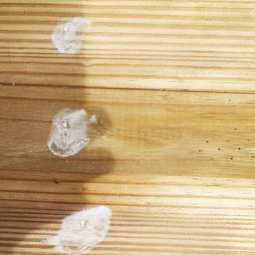 Caulk to fill nail holes